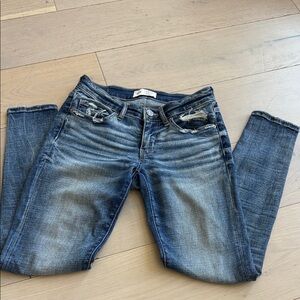 BKE Women's Faded Blue Skinny Jeans with Light Distressing